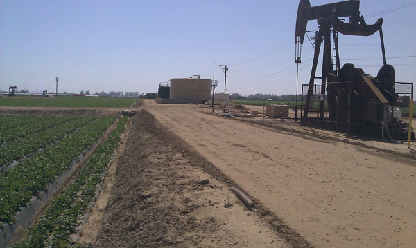 A fracking site within a field.