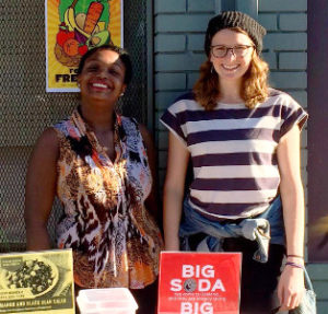 Julia Tubert, right, during her community engagement capstone project with the Hope Collaborative.
