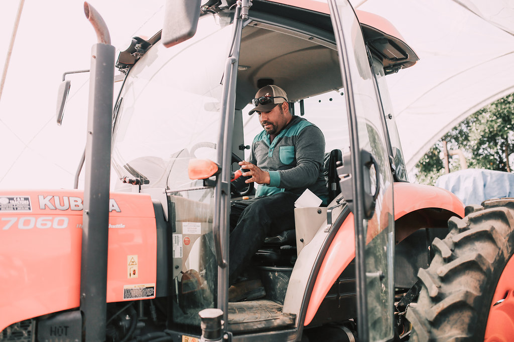 Juan in a tractor.