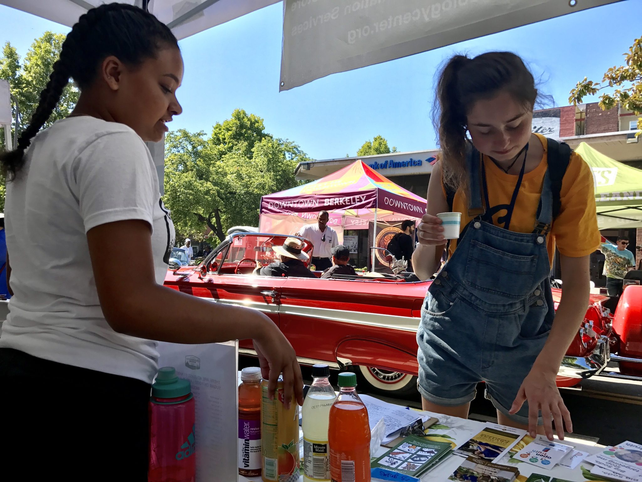 Youth Environmental Academy volunteers work at different outreach events to teach the community about the adverse health effects of sugar-sweetened beverages and share healthier food options. Photo by the Ecology Center.