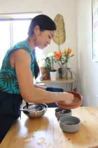 Portrait of Aileen as she prepares a homemade Filipino dish.