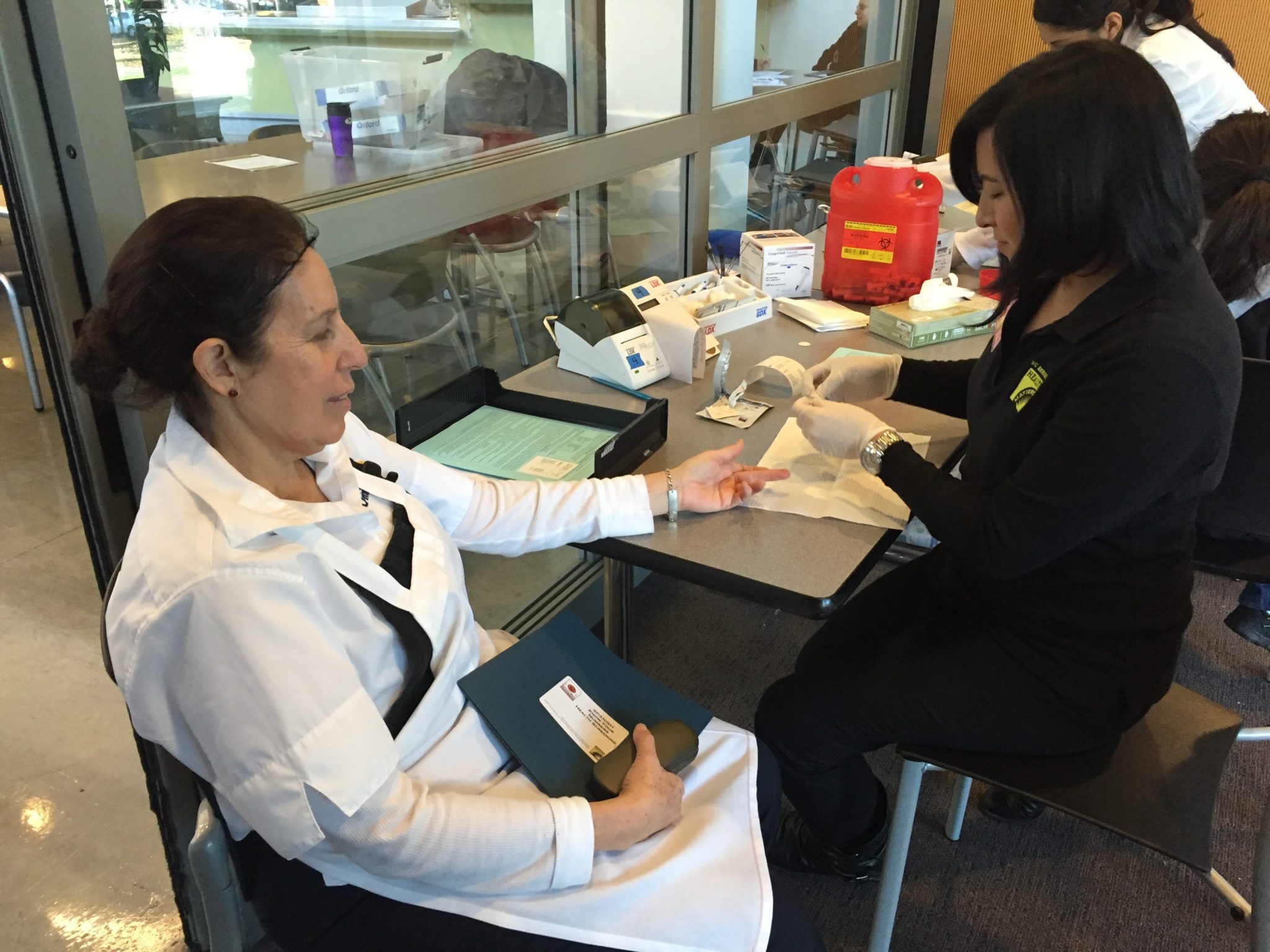 A CalDining worker gets a health screening