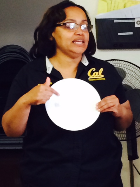Wellness leader Ramelda James holds up a plate to explain portion recommendations.
