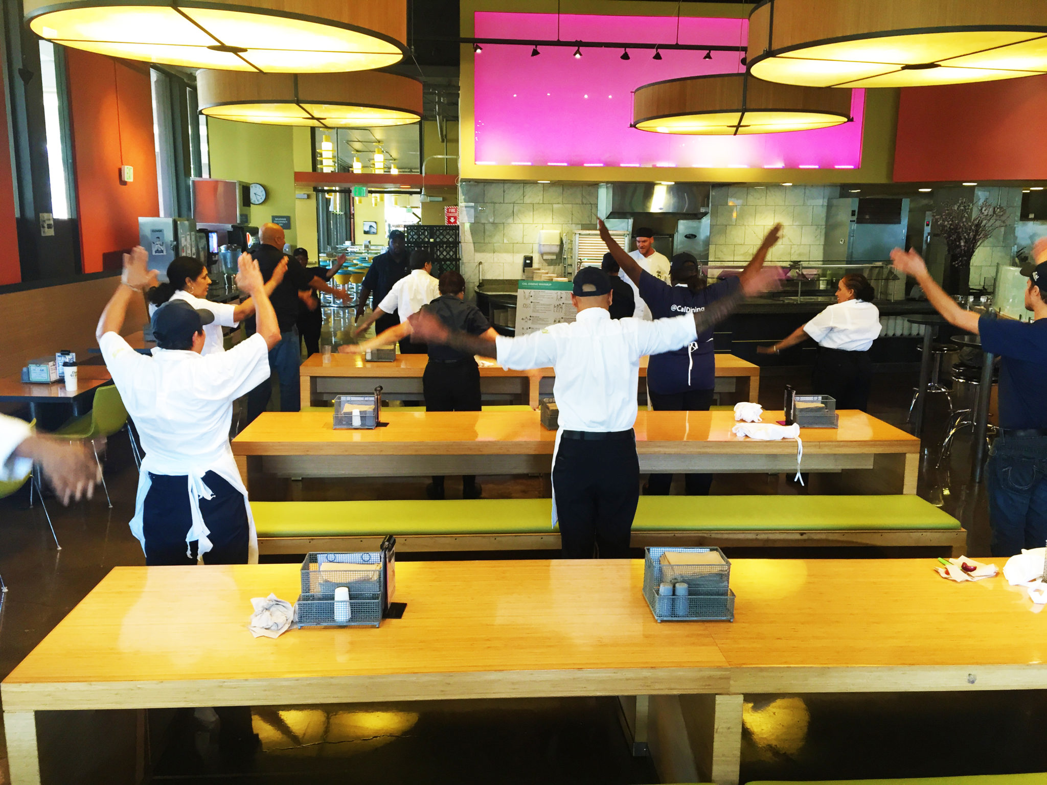 CalDining workers stretch before a shift at Cafe 3.