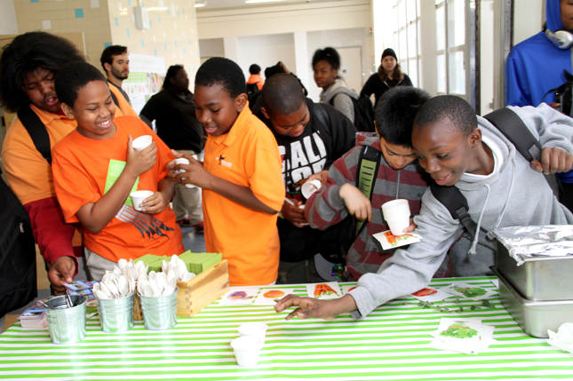 Middle School students have fun testing school meal menu choices in a taste testing session.