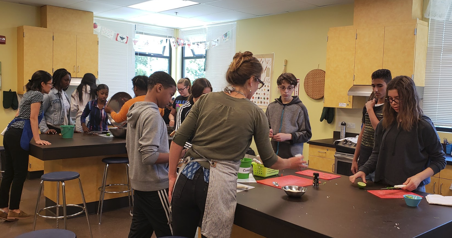 Berkeley Unified students learn about healthy eating while cooking a meal together. 