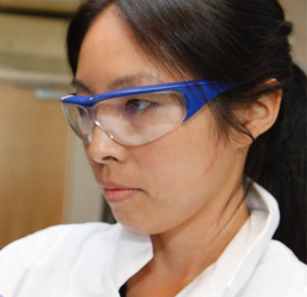 Scientist holds glass beaker